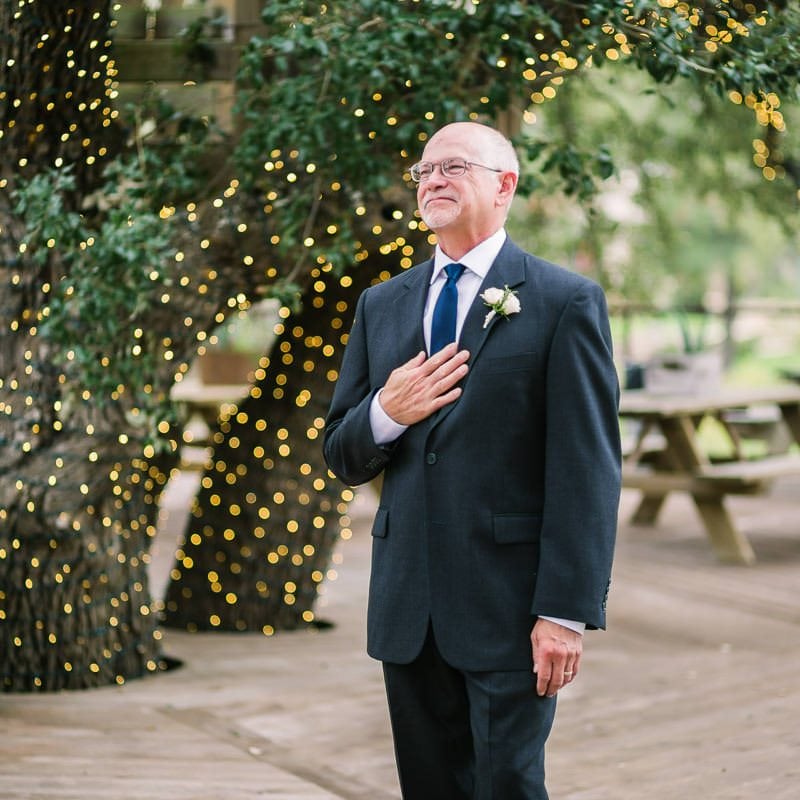 Father of bride sees daughter for first time in her wedding dress