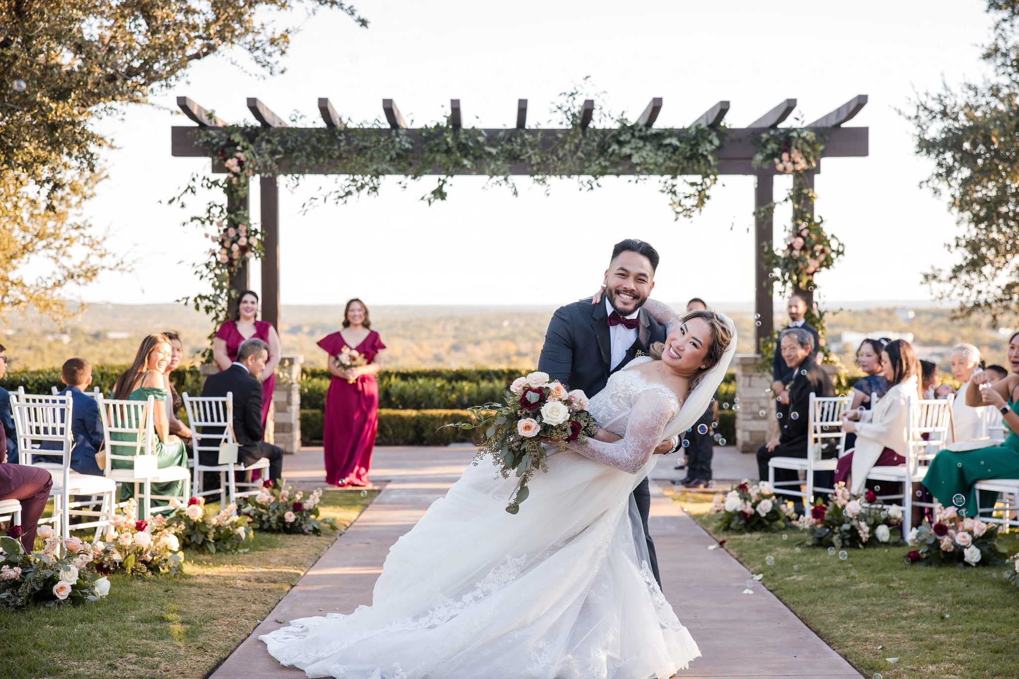 A couple celebrates after their wedding at Canyonwood Ridge in Austin, TX