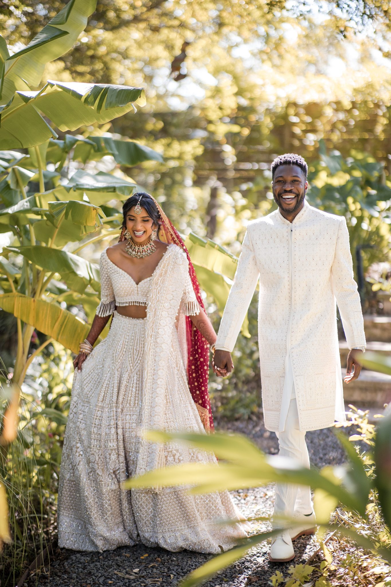 An Indian bride and a black groom celebrate after their wedding ceremony in Austin, TX.