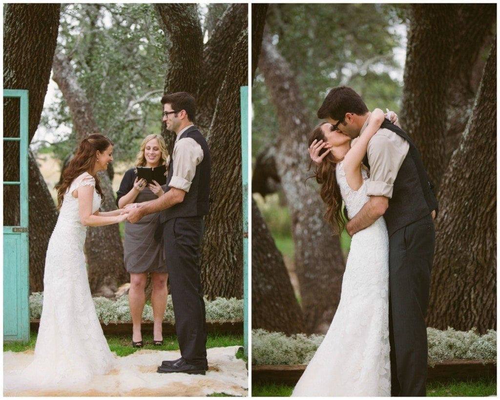 The bride and groom share their first kiss as man and wife.