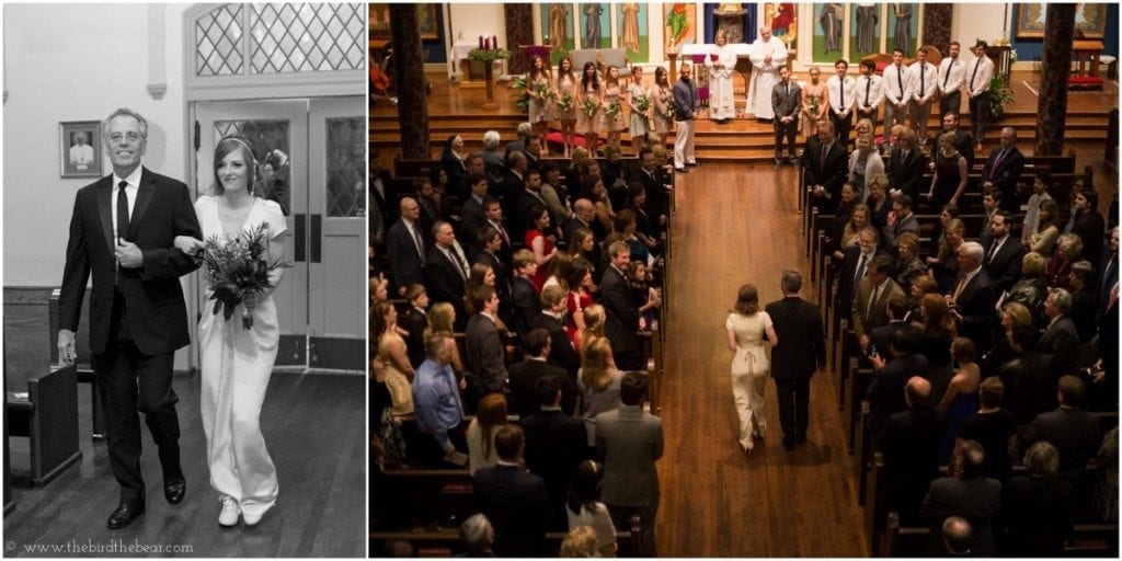 The bride walks down the aisle during her Catholic wedding ceremony.