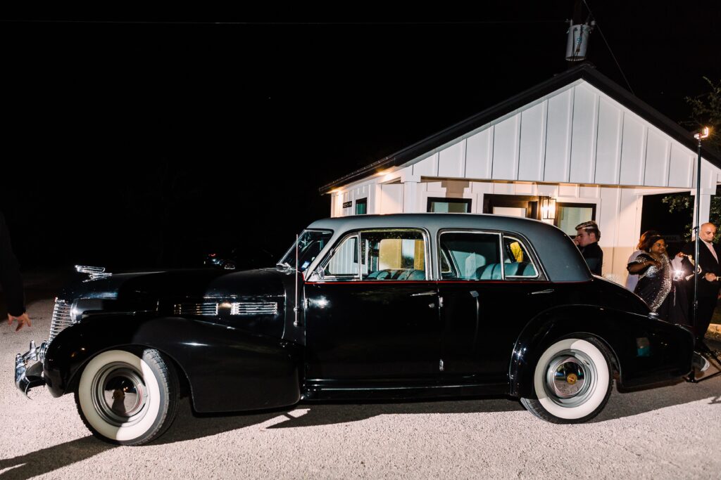 Classic black getaway car for Maes Ridge wedding reception
