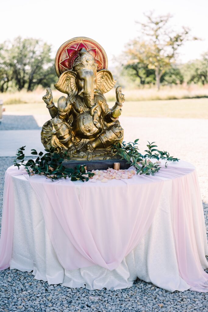 Pink and gold elephant ganesh table at Maes Ridge wedding