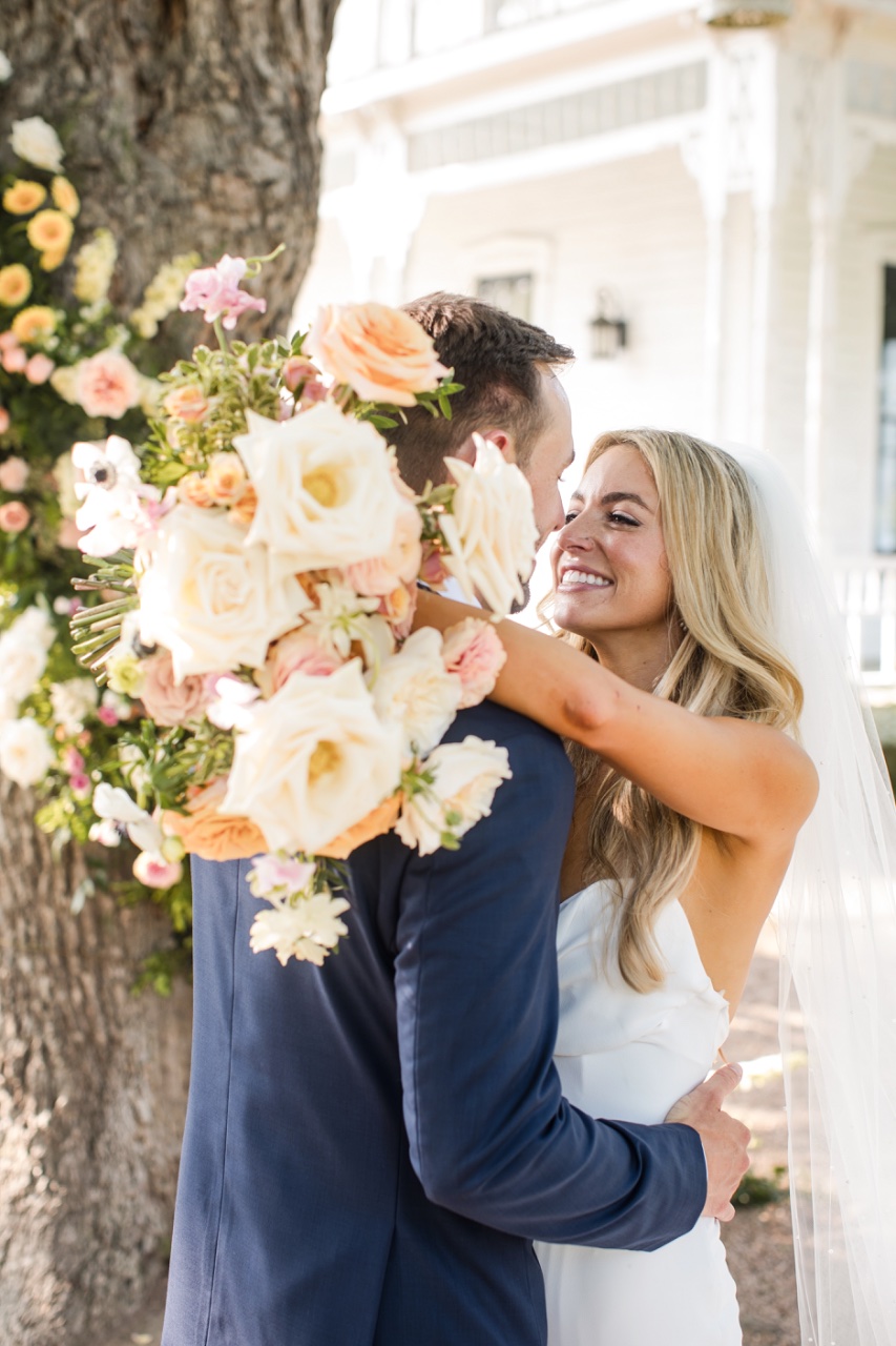 Couple walking to car during magical Barr Mansion wedding exit