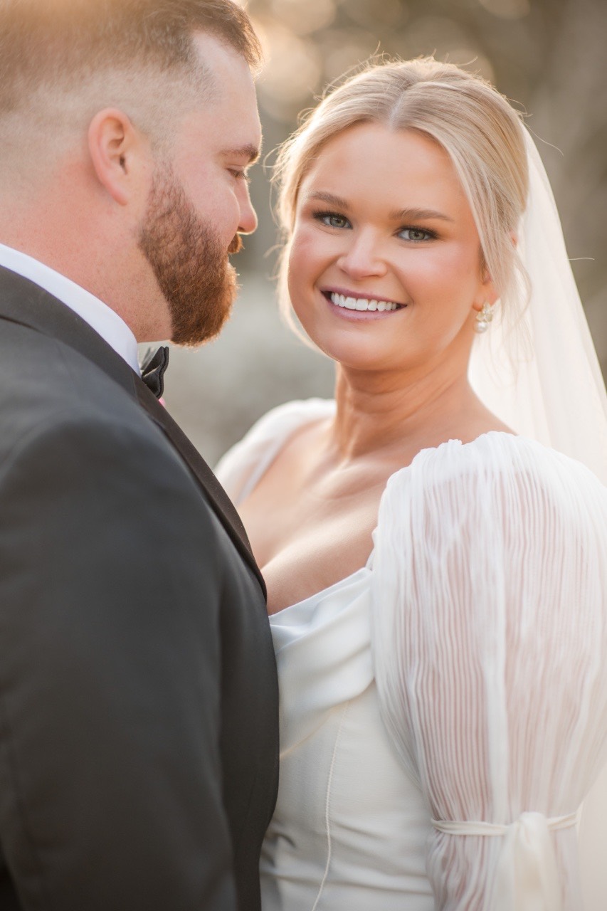 Bride Cora approaching groom for emotional first look moment together