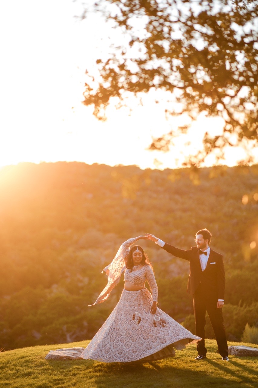 Bride's intricate bridal jewelry and henna details before ceremony