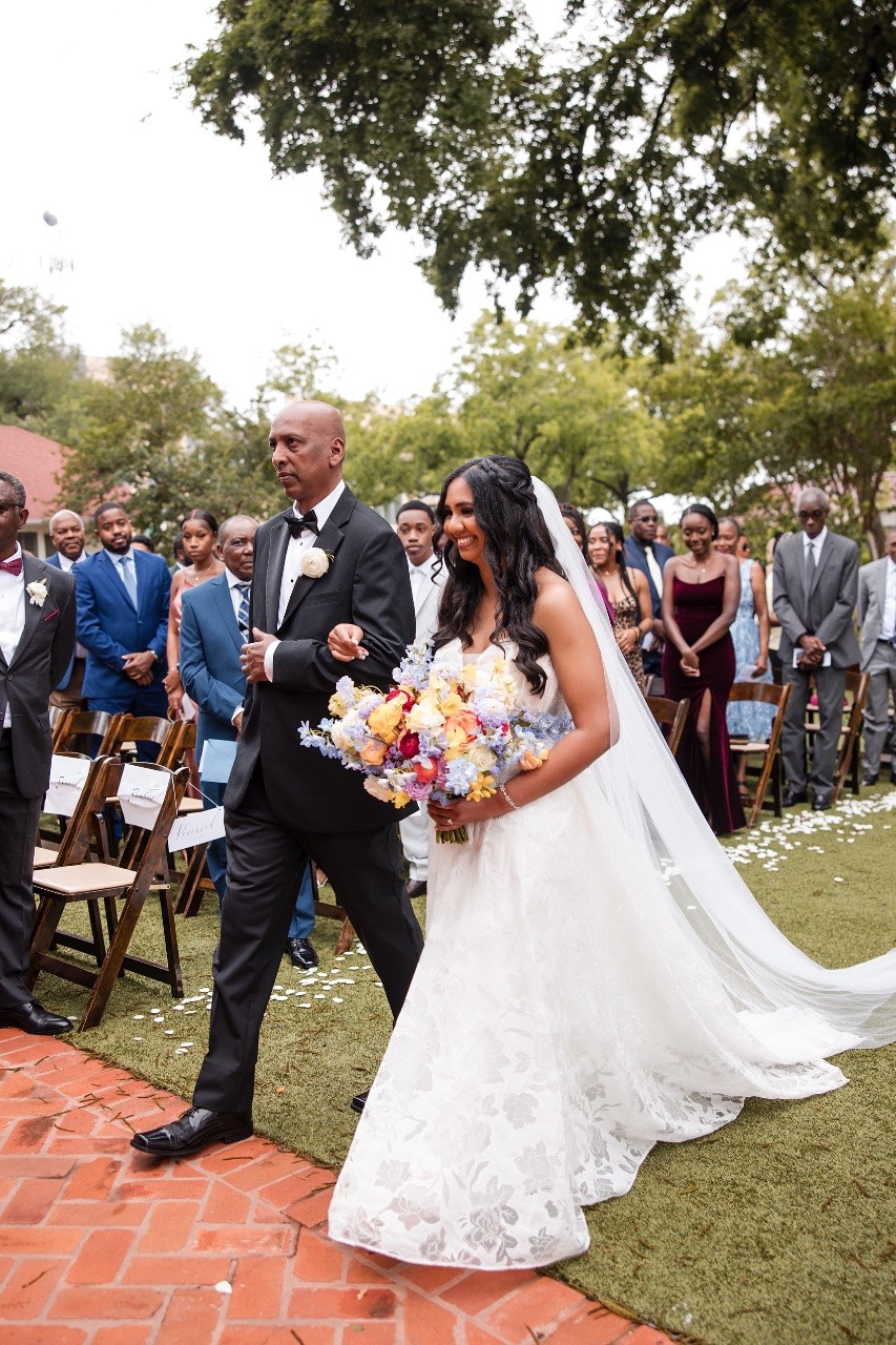 Couple walking together after first look at Woodbine Mansion Round Rock