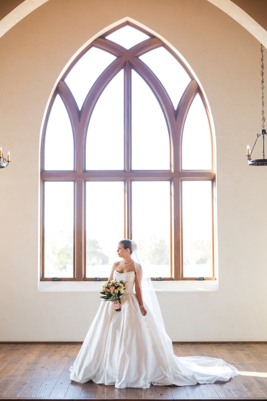 Close-up of bride's wedding dress details at Lampasas venue