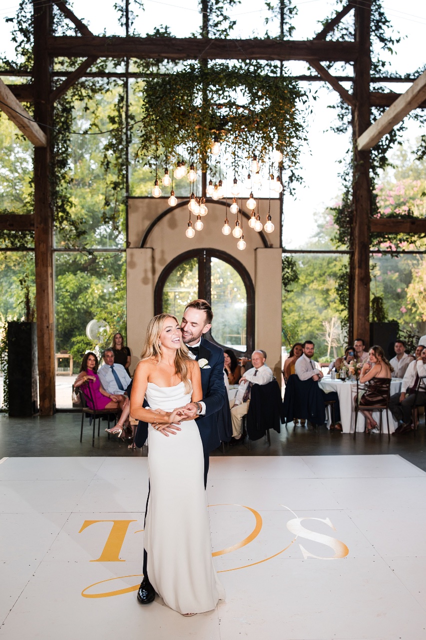 Couple embracing during intimate first look at Austin's Barr Mansion
