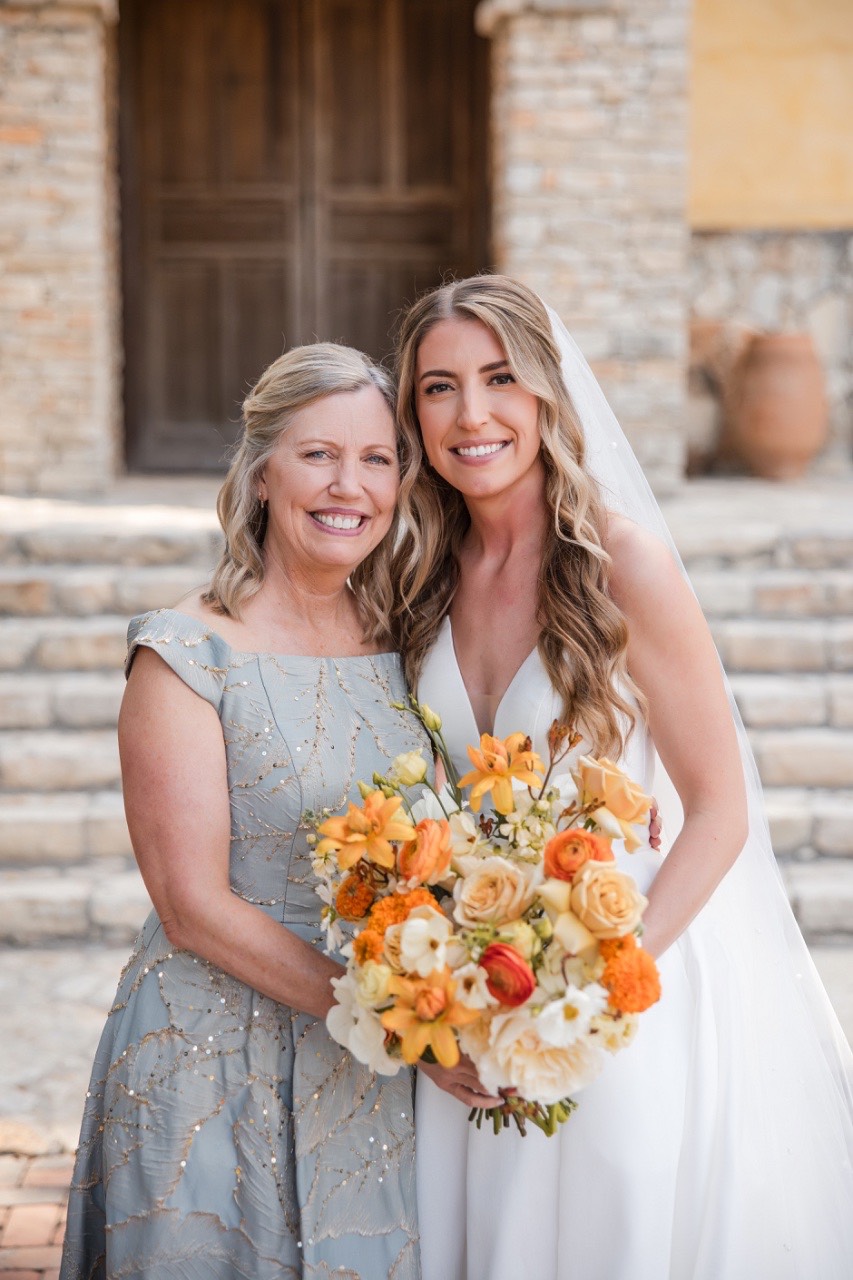 Wedding ceremony details with Wild Bunches floral arrangements at Camp Lucy