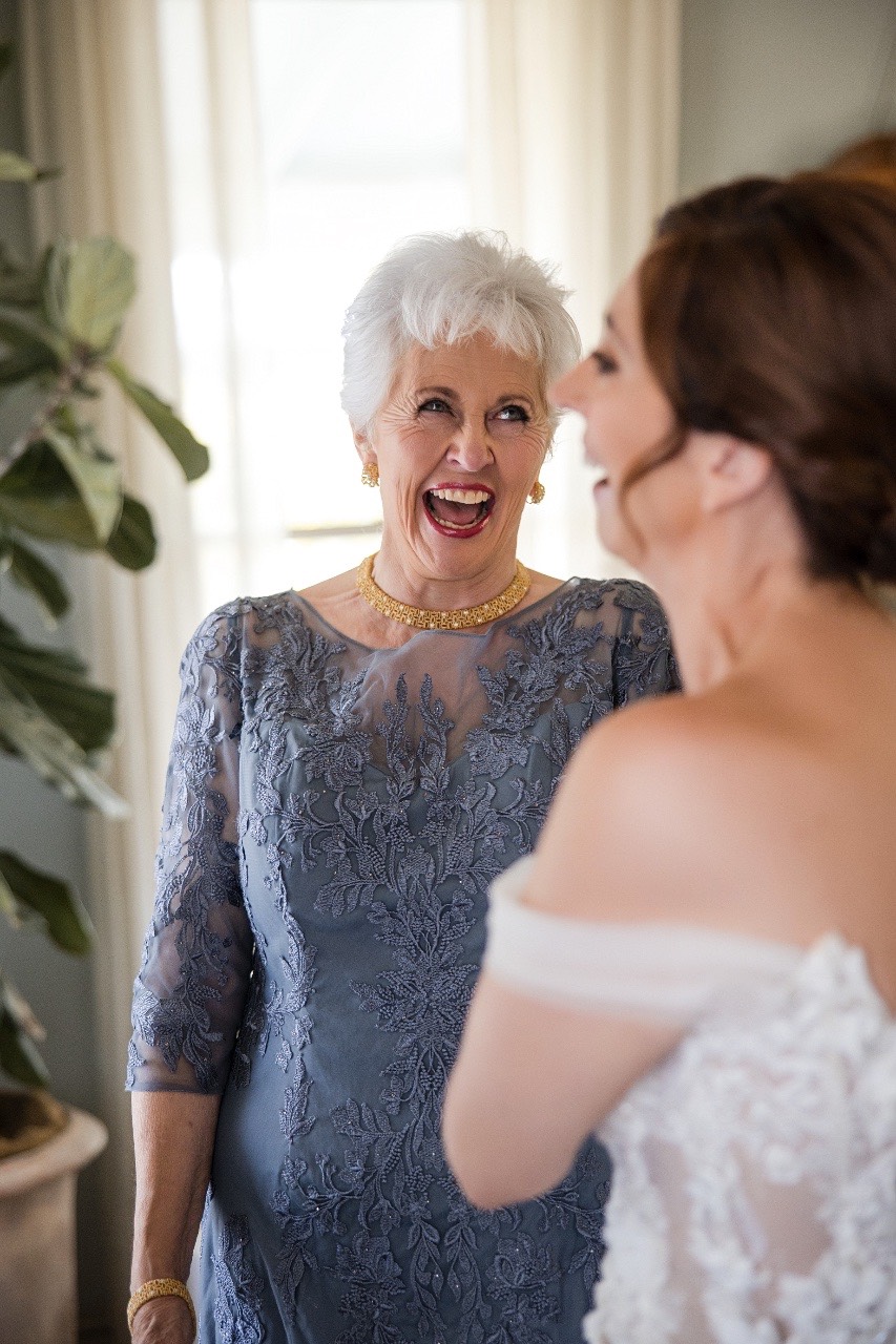 Bride L's veil being arranged by bridesmaid at Barr Mansion venue