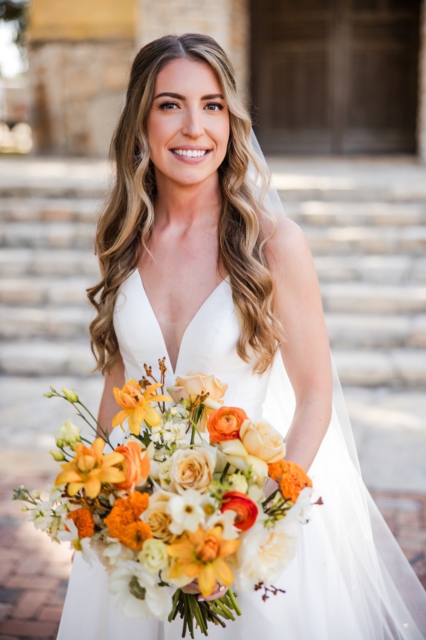 Bride and groom kiss at altar of Ian's Chapel Dripping Springs