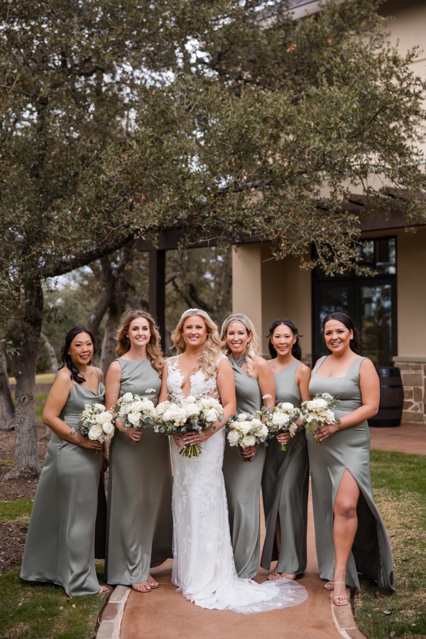 Groom's boutonniere pinned before first look at Canyonwood Ridge winter wedding