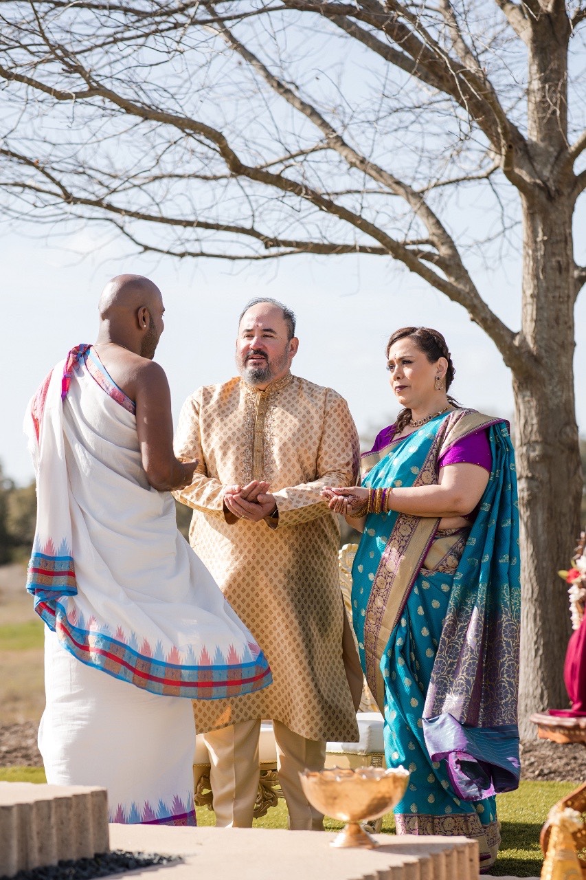 Bride and groom kiss during ceremony at Prospect House Dripping Springs venue