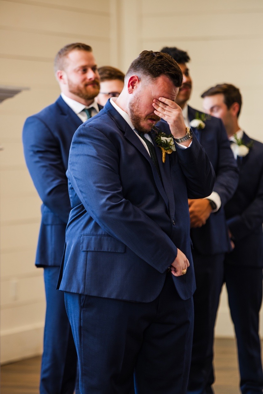 Bridesmaids and groomsmen pose together during Highpointe Estate wedding day celebration.