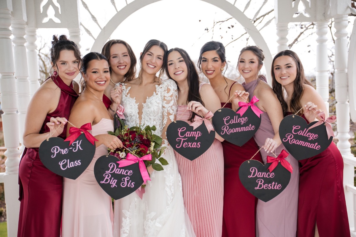 Candid moment of bride with bridesmaids during getting ready.