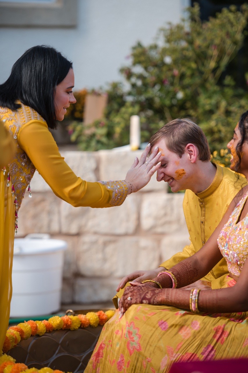 Bride walking toward groom for first look before Two Hearts One Stream ceremony