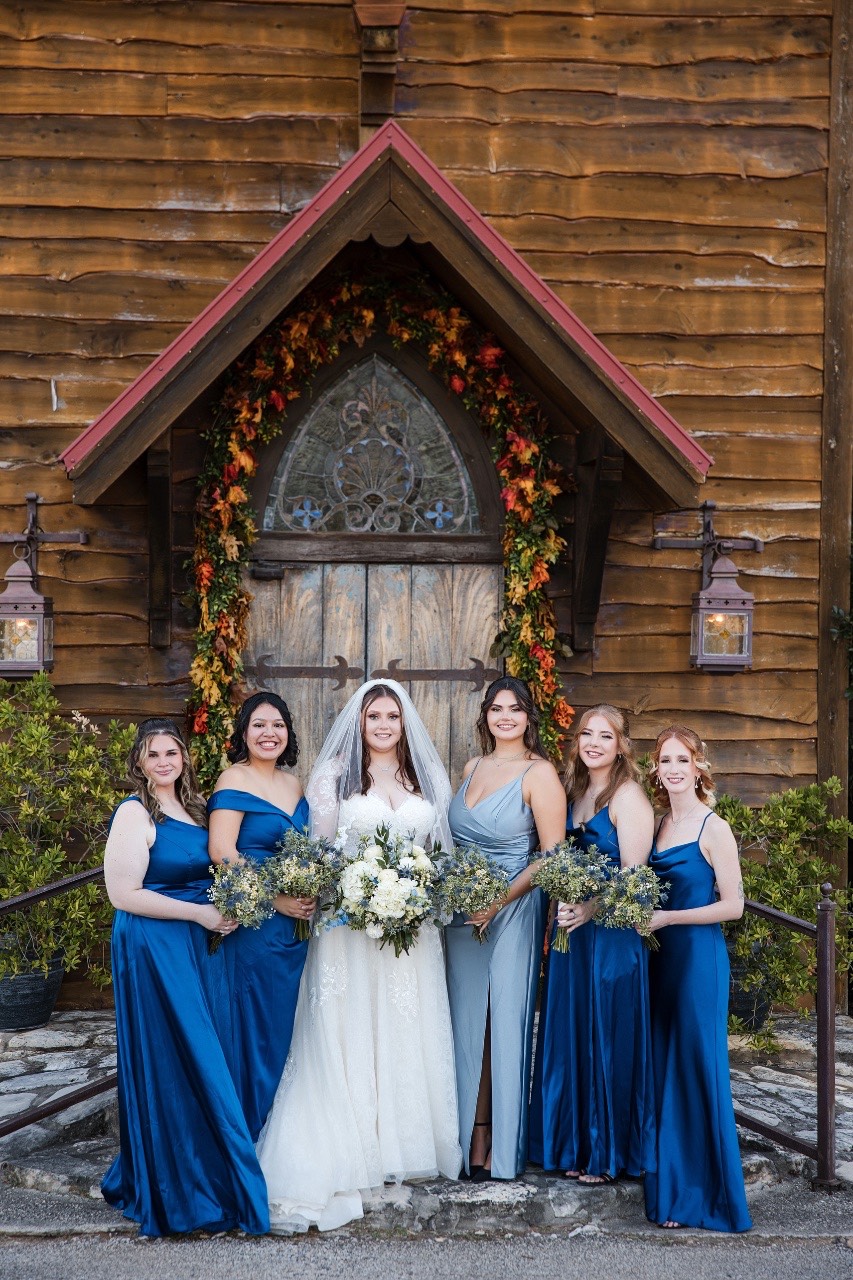 Wedding ceremony setup at Old Glory Ranch with rustic ranch backdrop Wimberley