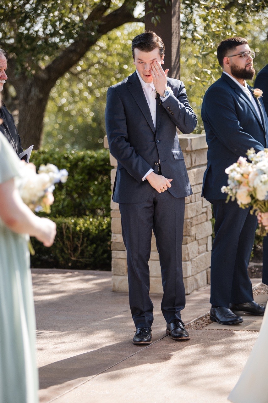 Bride and groom first look portrait at scenic Canyonwood Ridge in Dripping Springs