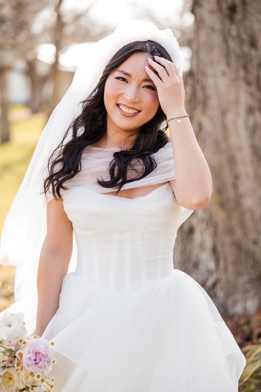 Wedding rings exchanged between L and M at Pecan Springs Ranch ceremony
