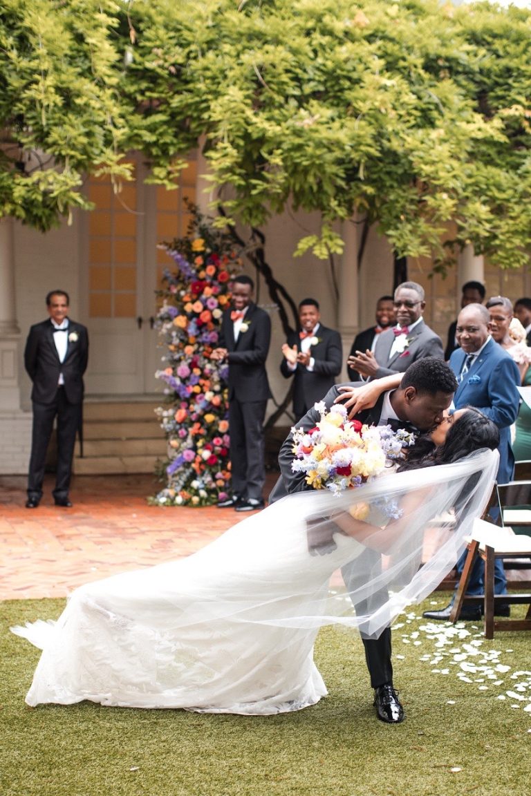 Woodbine Mansion wedding where the couple kiss after saying their wedding vows