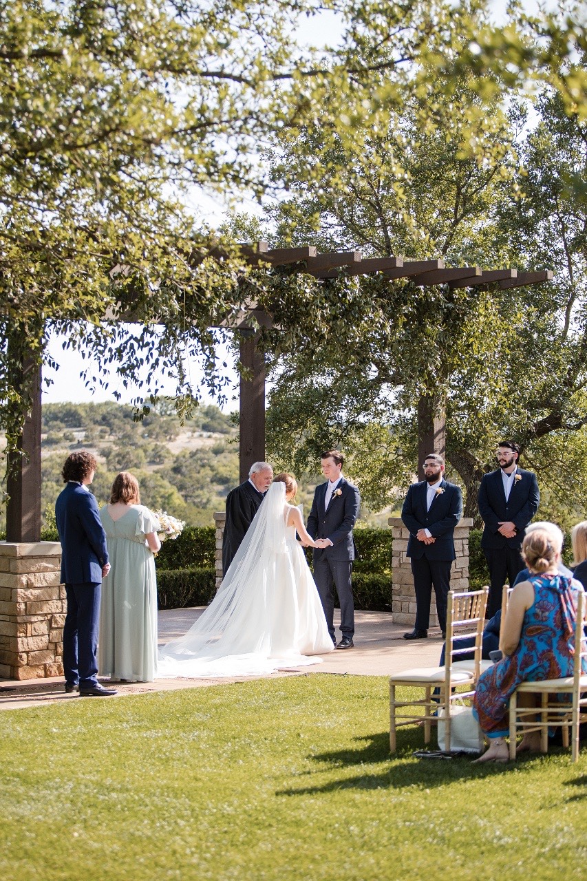 Couple's first look captured by professional videographer at Canyonwood Ridge wedding