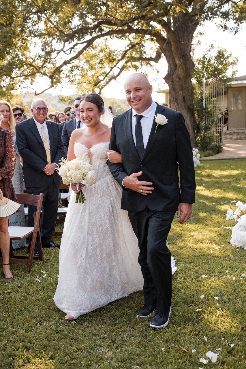 Newly married couple Darby and Will celebrating at Pecan Springs Ranch