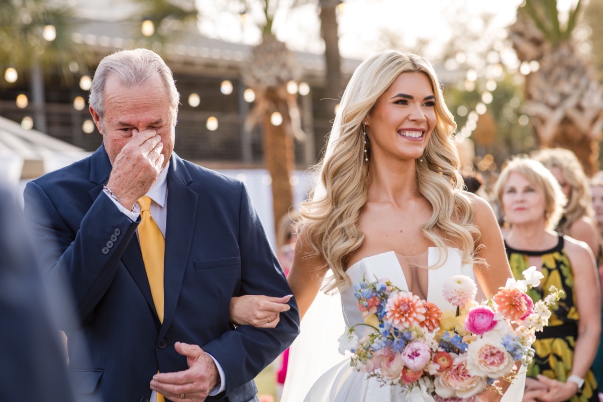 Bride A walks toward groom S for Horseshoe Bay Resort first look