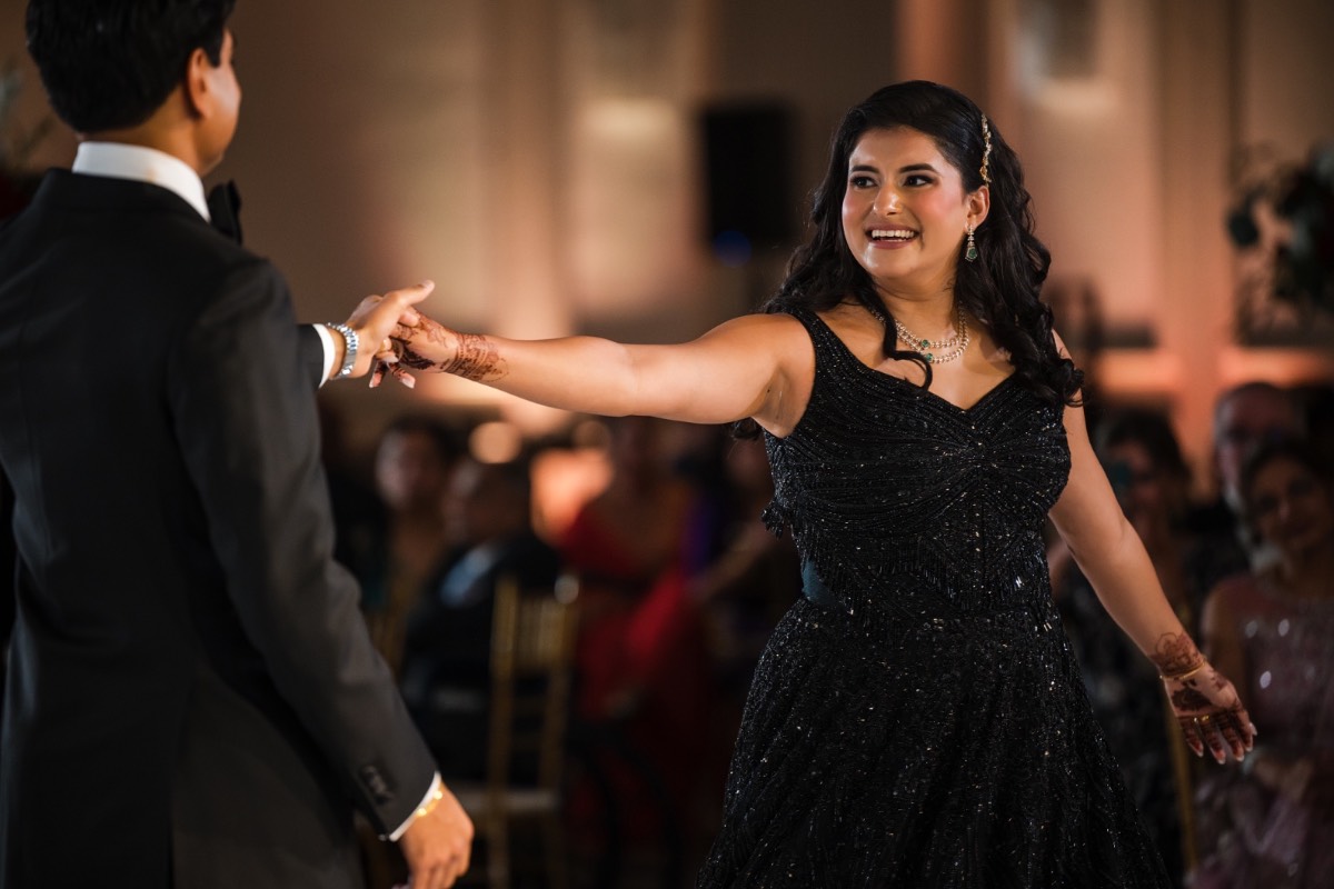 M and R exchanging vows during ceremony at Renaissance Austin Hotel venue