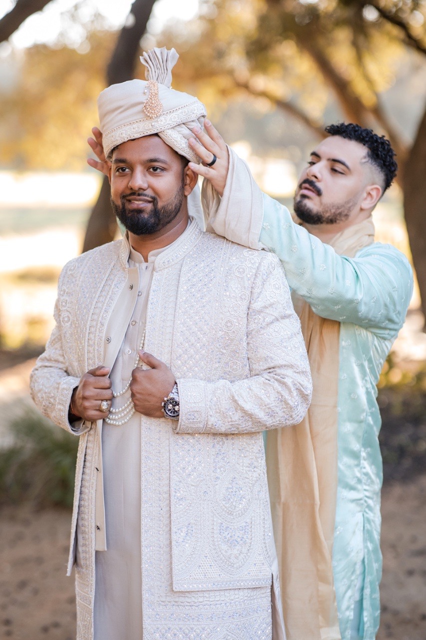 Tender embrace during couple's first look before Hyatt Hill Country ceremony