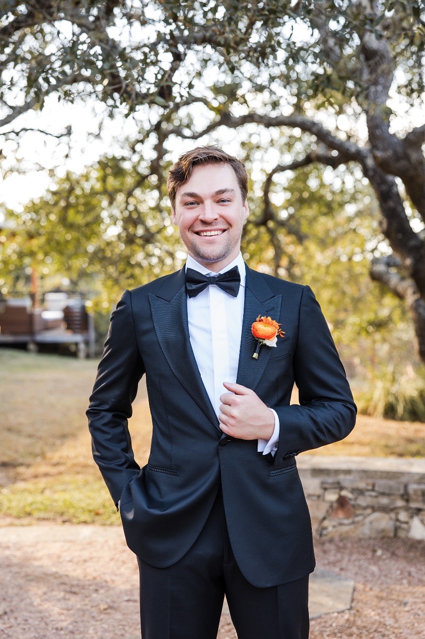 Romantic couple photo with Texas Hill Country backdrop at Camp Lucy