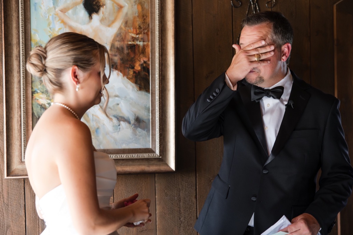Newlyweds walking back up aisle after Hidden River Ranch wedding ceremony
