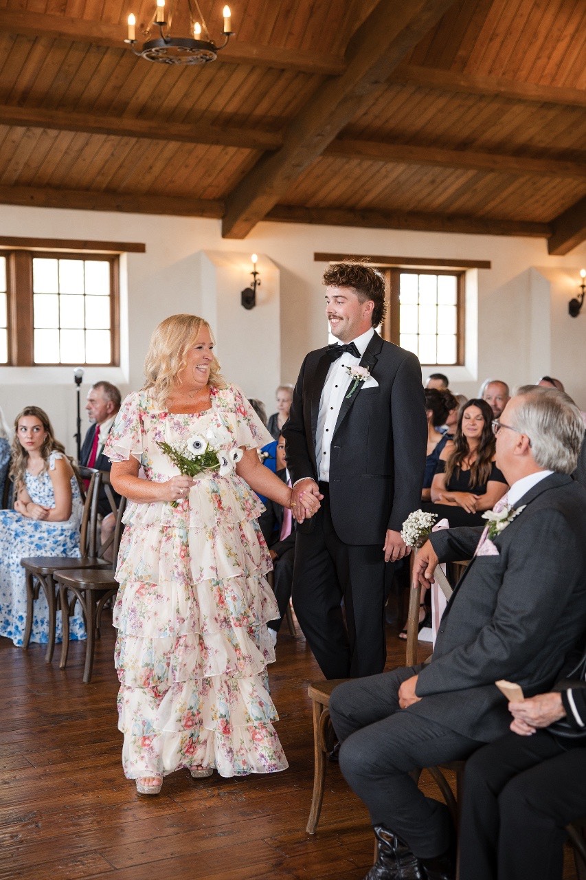 Groom spinning bride after being announced as married couple