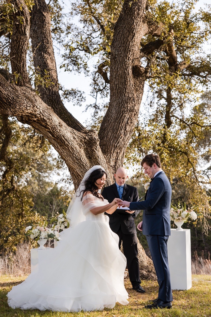 Pecan Springs Ranch wedding videography capturing L and M's recessional moment
