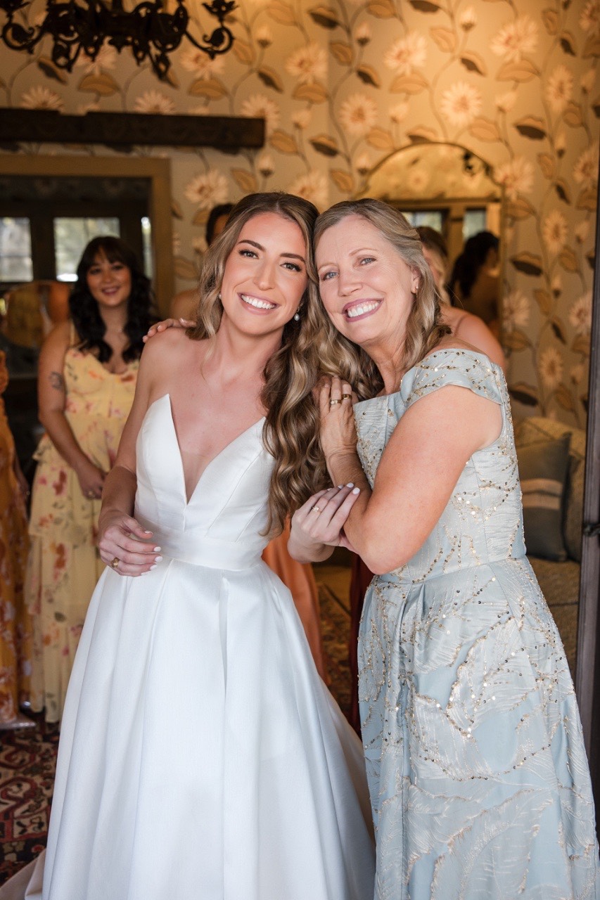 C's bridal preparations with professional makeup artist at Camp Lucy venue