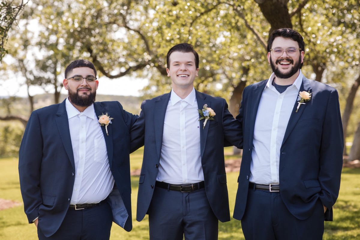 Bride's wedding dress details at Canyonwood Ridge venue in Dripping Springs