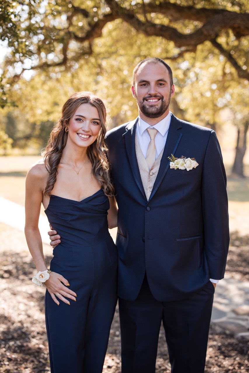 Couple walking together after first look toward Ma Maison ceremony space