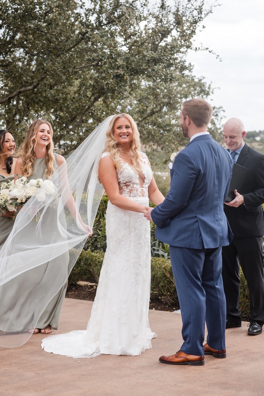 Bride walking toward groom for first look at Canyonwood Ridge Texas