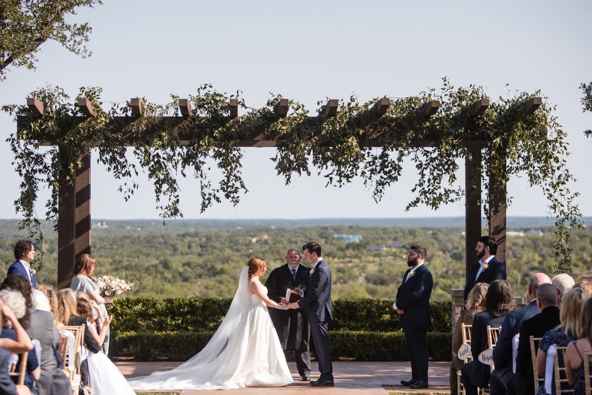 Wedding ceremony backdrop at scenic Canyonwood Ridge venue in Dripping Springs Texas