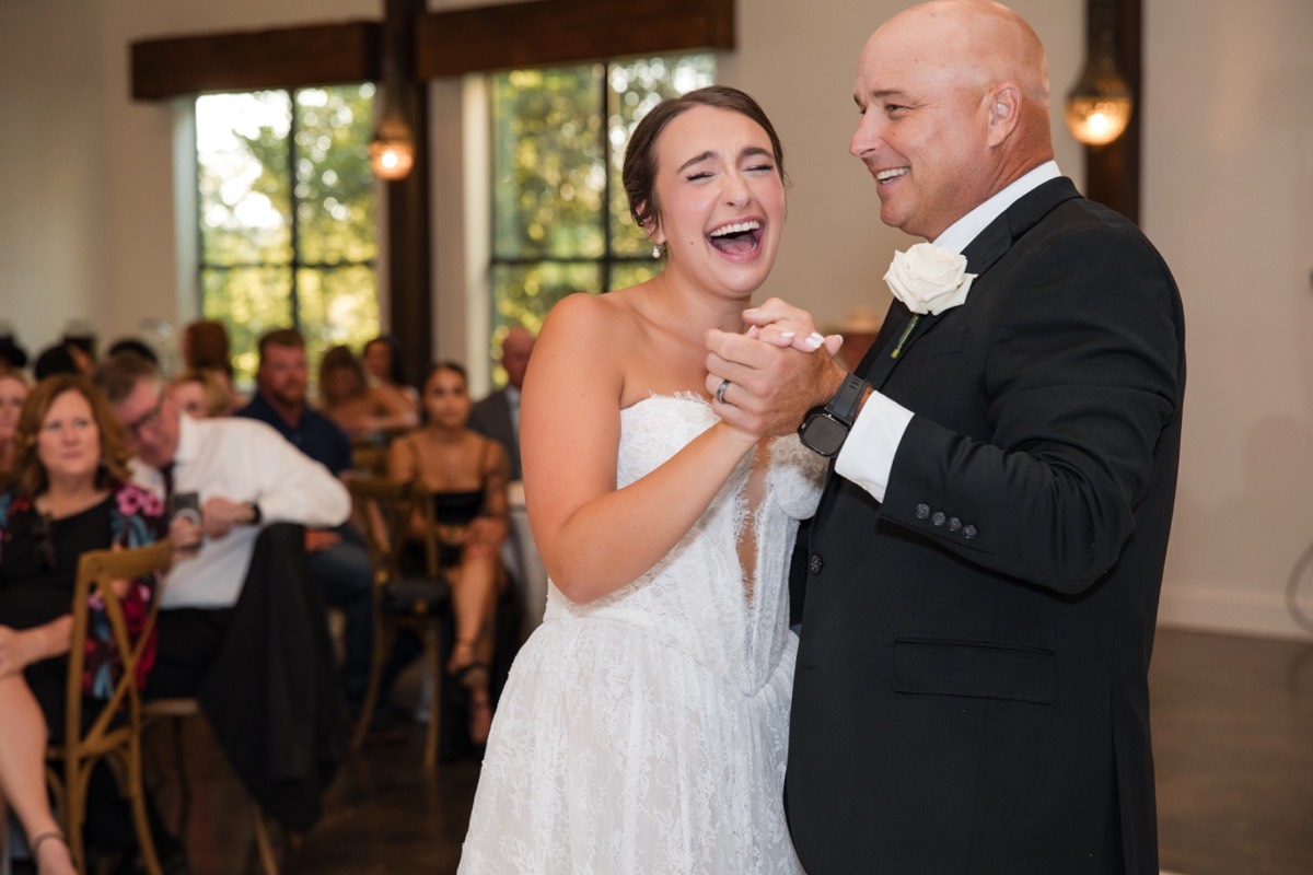 Candid laugh between couple during Pecan Springs Ranch wedding photography session
