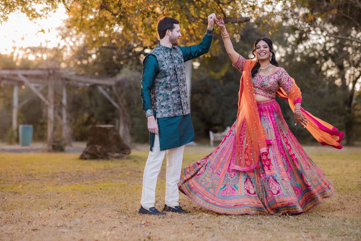 Bride and groom posing on grounds of Dripping Springs wedding venue