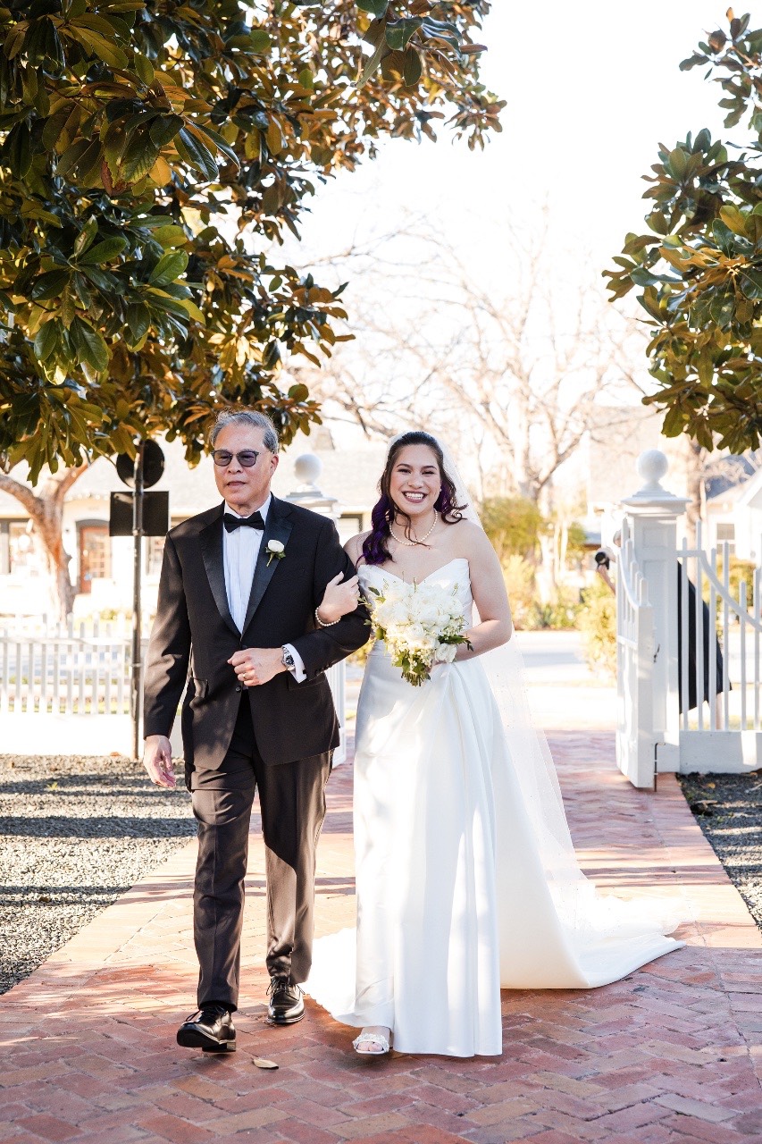 Bride walking down aisle at Woodbine Mansion ceremony in Round Rock