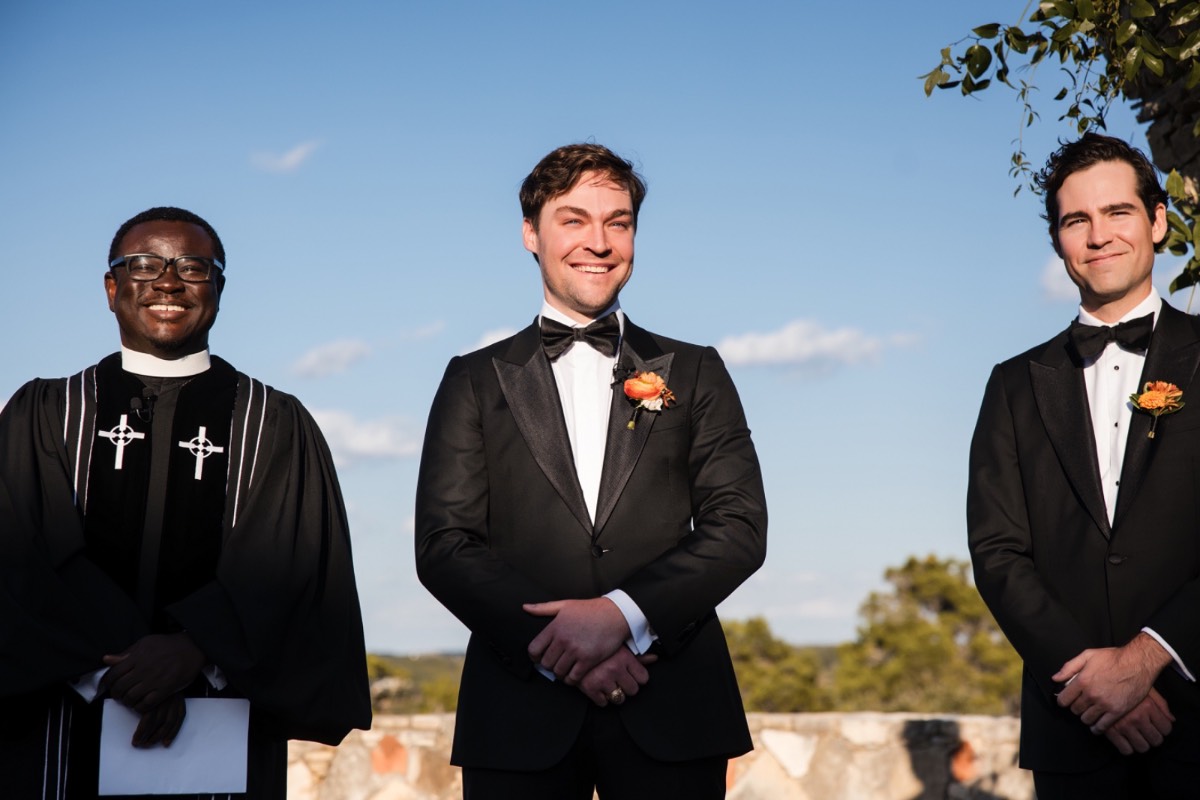 Groom dipping bride during romantic portrait at Camp Lucy Dripping Springs