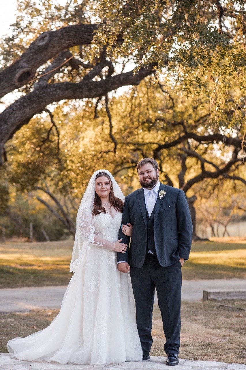 Newlyweds S and D celebrating after ceremony at Old Glory Ranch Wimberley Texas