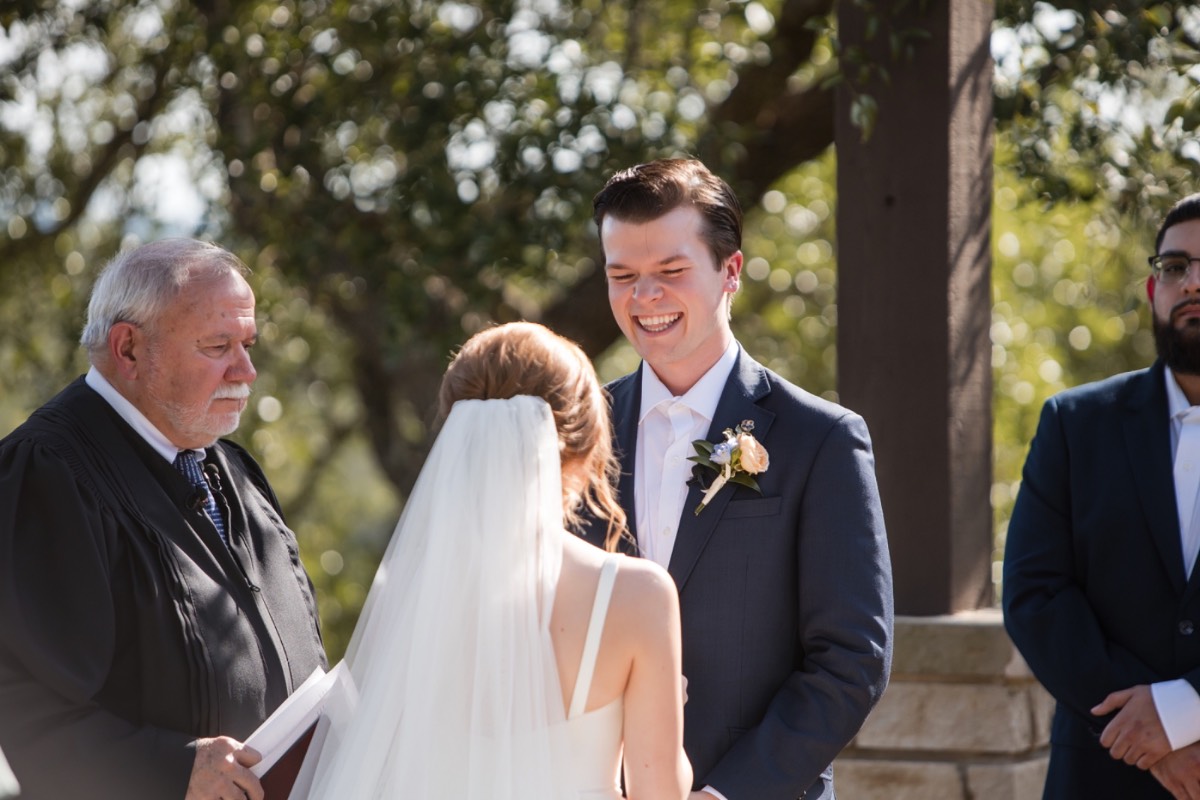 O walks down the aisle toward groom C at Canyonwood Ridge