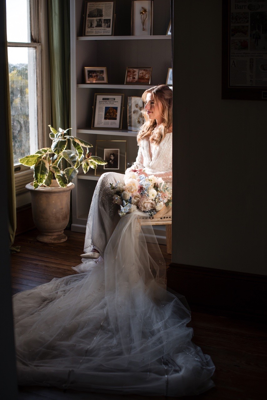 Bride and groom smiling during golden hour first look session.