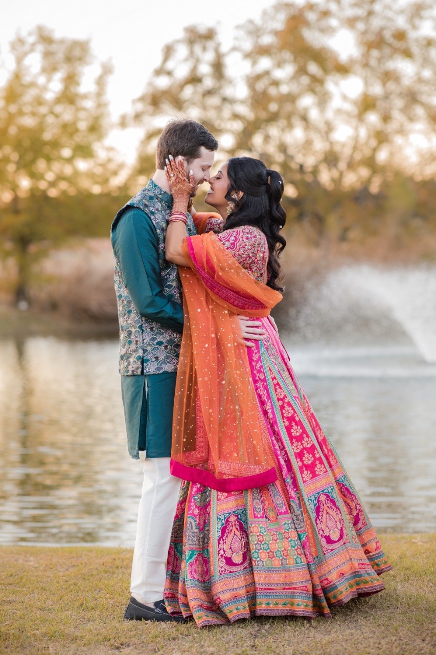 Formal couple portrait with Canyonwood Ridge architecture in background