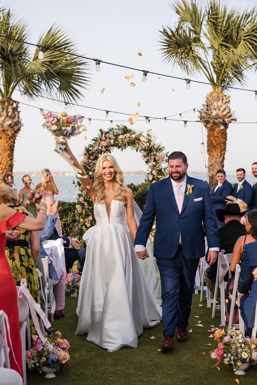 Groom S watches bride A walk down aisle at Horseshoe Bay Resort