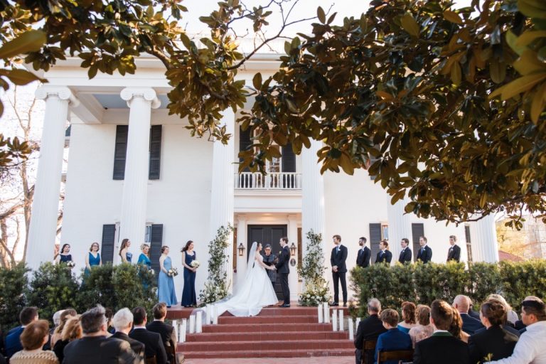 Groom's expression as bride arrives at Woodbine Mansion wedding ceremony