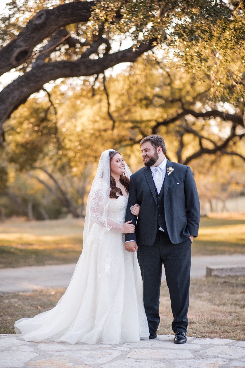 The Bird and The Bear videographer documenting kiss at Old Glory Ranch wedding